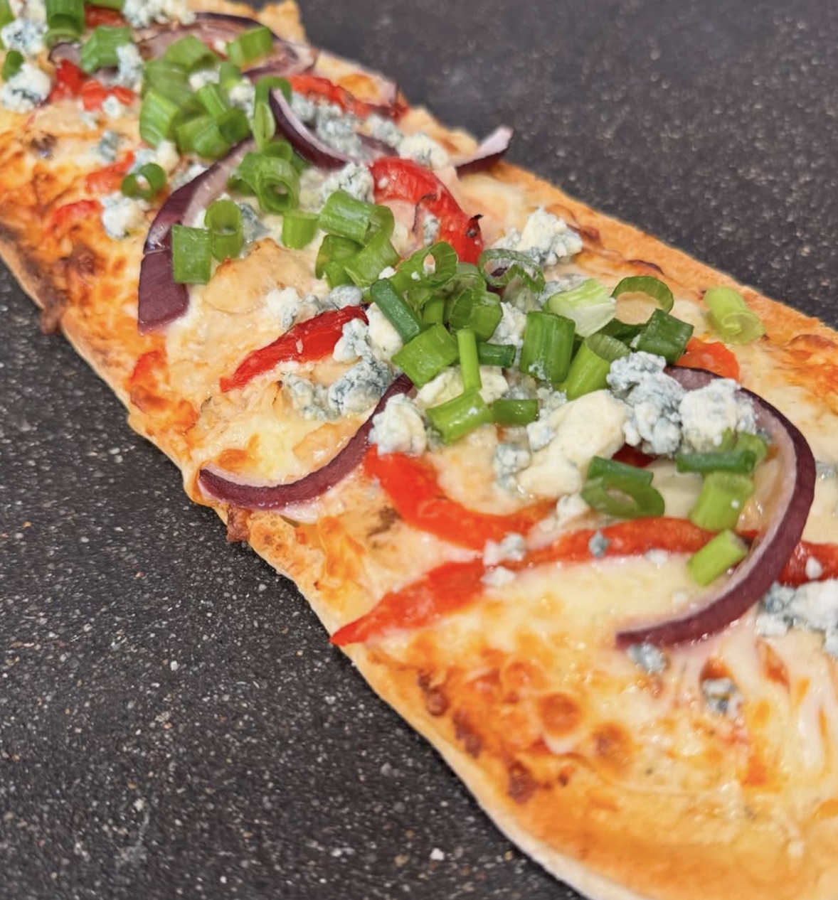 A flatbread fresh from the oven at Caterina's